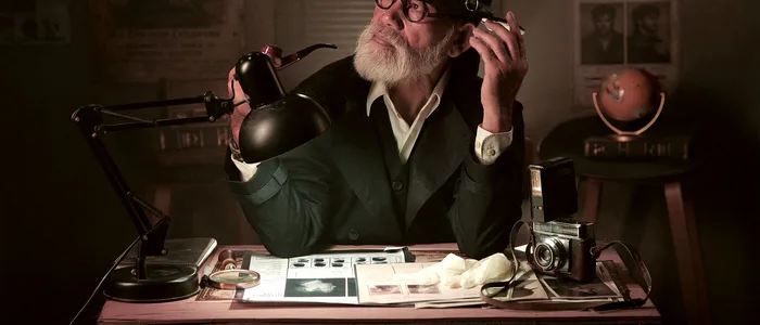 A vintage detective at a lamp-lit desk, examining fingerprints with a magnifying glass